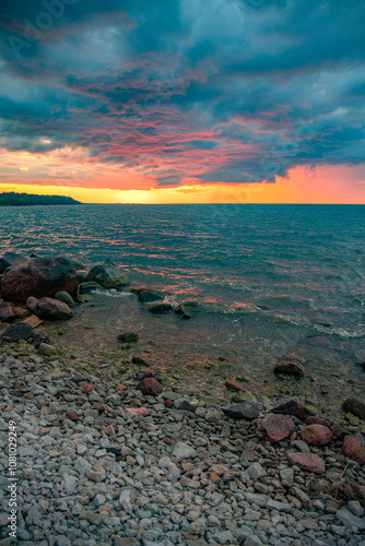 sunset on the rocky seashore photo