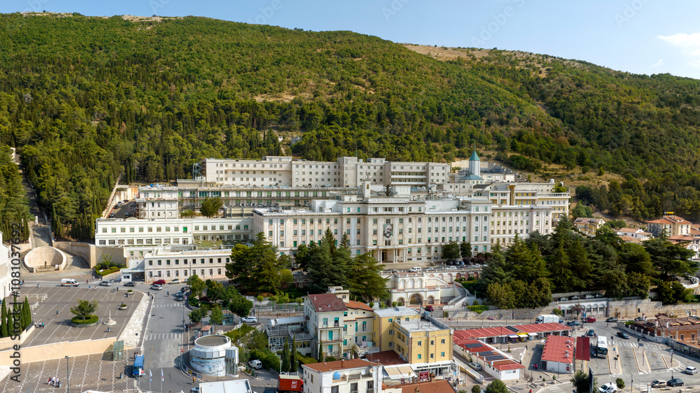 Fototapeta premium Aerial view of the Home for the Relief of Suffering (Ospedale Casa Sollievo della Sofferenza) hospital located in San Giovanni Rotondo, in the province of Foggia, in Puglia, Italy.