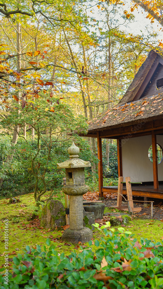 old garden stone lantern with wood house in autumn park old garden stone lantern with wood house in autumn park