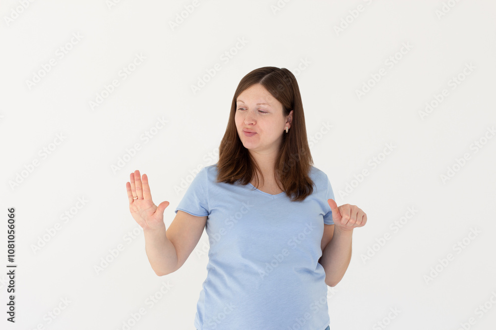 Young caucasian woman looking at manicure on white background Young caucasian woman looking at manicure on white background