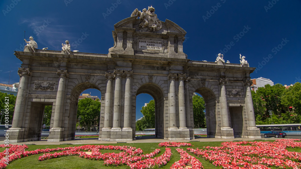 Fototapeta premium The Puerta de Alcala timelapse hyperlapse is a Neo-classical monument in the Plaza de la Independencia in Madrid, Spain.