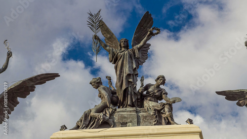 Statue on the top of government palace facade the Ministry of Agriculture building timelapse hyperlapse in Madrid, Spain.