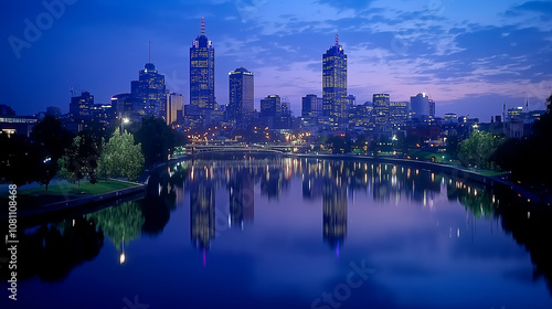 Evening city skyline reflecting on river with vibrant lights and colorful sky