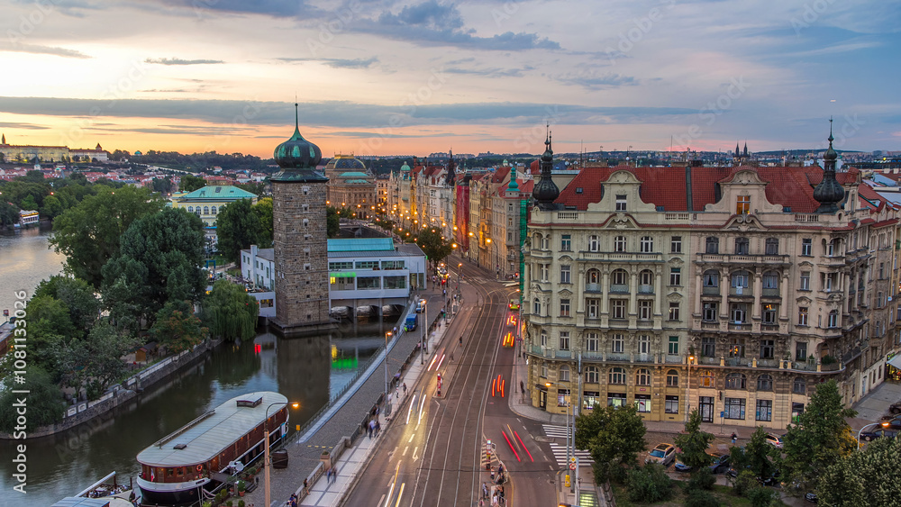 Fototapeta premium Sitkovska water-tower timelapse and traffic on road in old city center of Prague day to night.