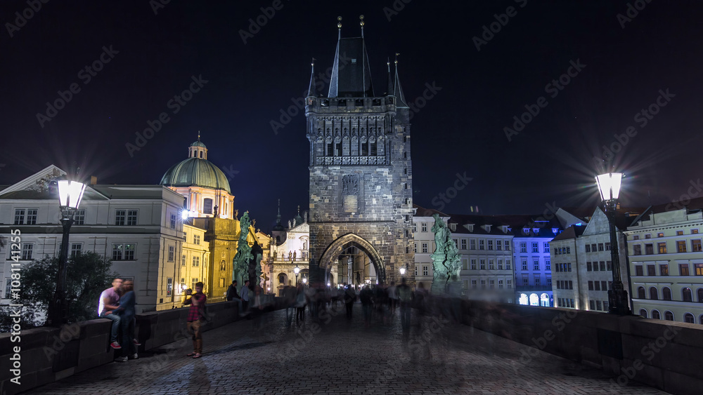 Fototapeta premium Magnificent Gothic structure called Stare Mesto Tower timelapse hyperlapse on Charles Bridge