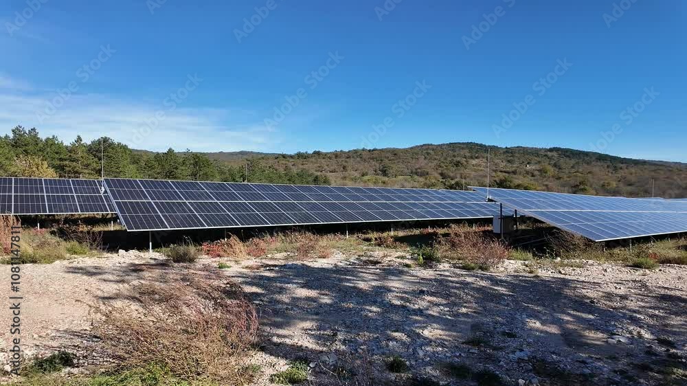 Solar panel farm in a rural landscape under clear skies, emphasizing renewable energy and Earth Day Solar panel farm in a rural landscape under clear skies, emphasizing renewable energy and Earth Day