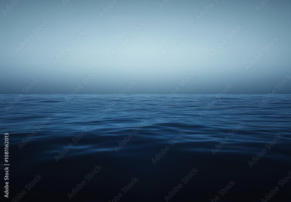 Obraz premium A single, large cloud hangs in the sky over a vast, blue ocean on a cloudy day