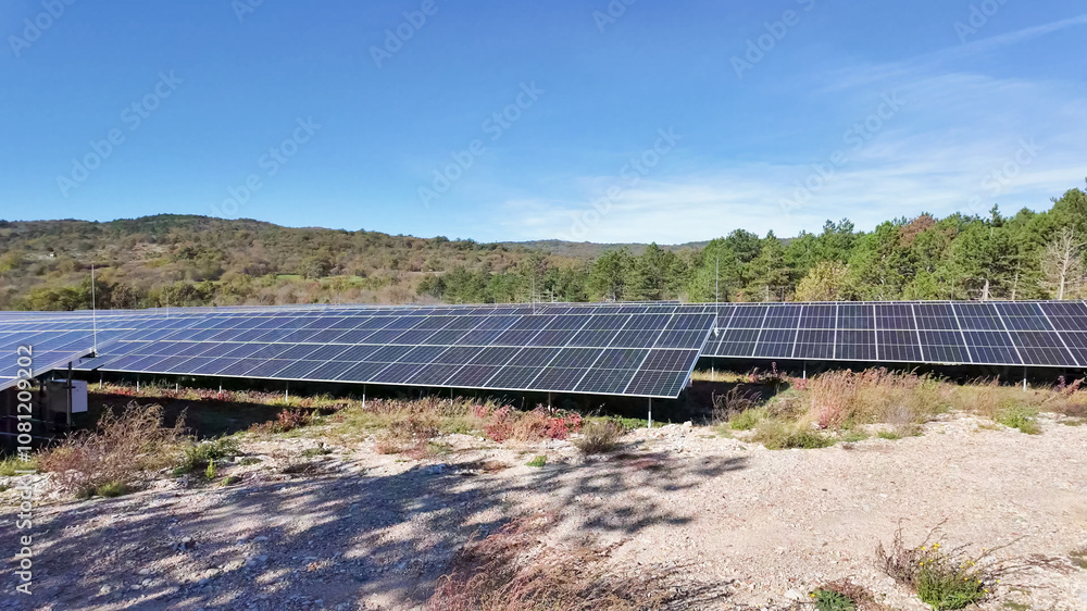 Fototapeta premium A vast solar panel farm under a clear blue sky, highlighting renewable energy solutions and environmental sustainability Dolomite Alps, Dolomites
