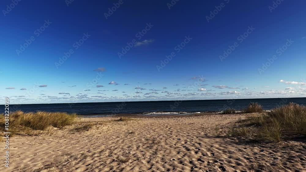 Sunny, windy weather by the sea. Sea beach in autumn. Sunny, windy weather by the sea. Sea beach in autumn.