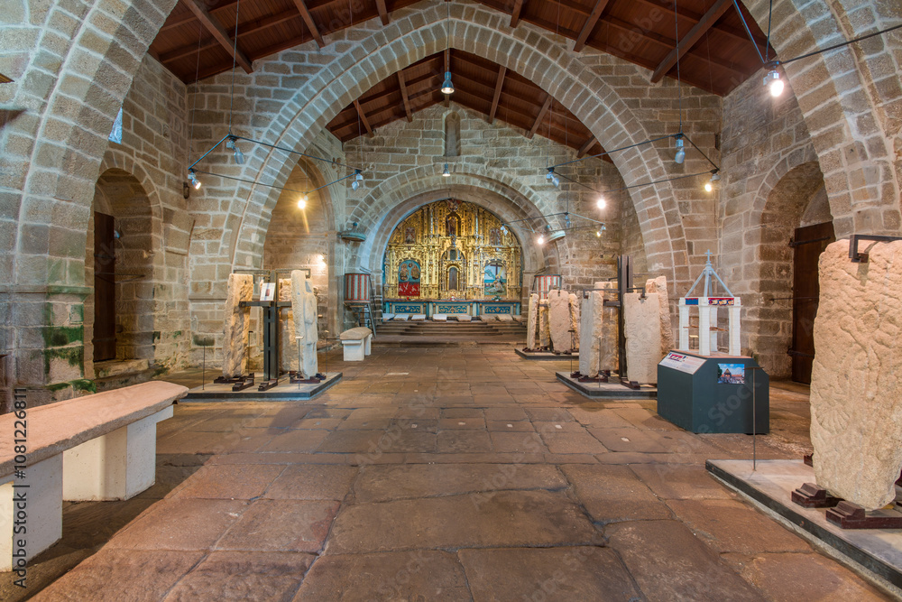 Fototapeta premium Interior of Church of Santa Maria a Nova with medieval tombstones, Noia