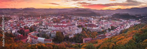 Obraz na płótnie Walbrzych, sunset with a view of the city center and the Walbrzych Mountains. View of the city from the observation tower in Jan Sobieski Park, colorful autumn evening. w salonie