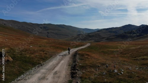 Drone flight over Mountainbiker in the mountains