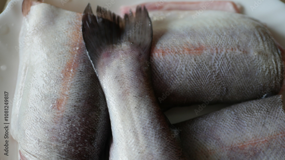 Naklejka premium Pieces of trout on a plate