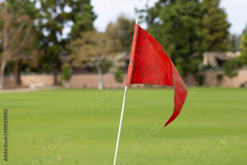 bright orange red soccer field flag