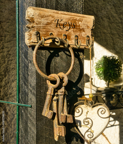 old rusty bunch of keys hanging on a key rack