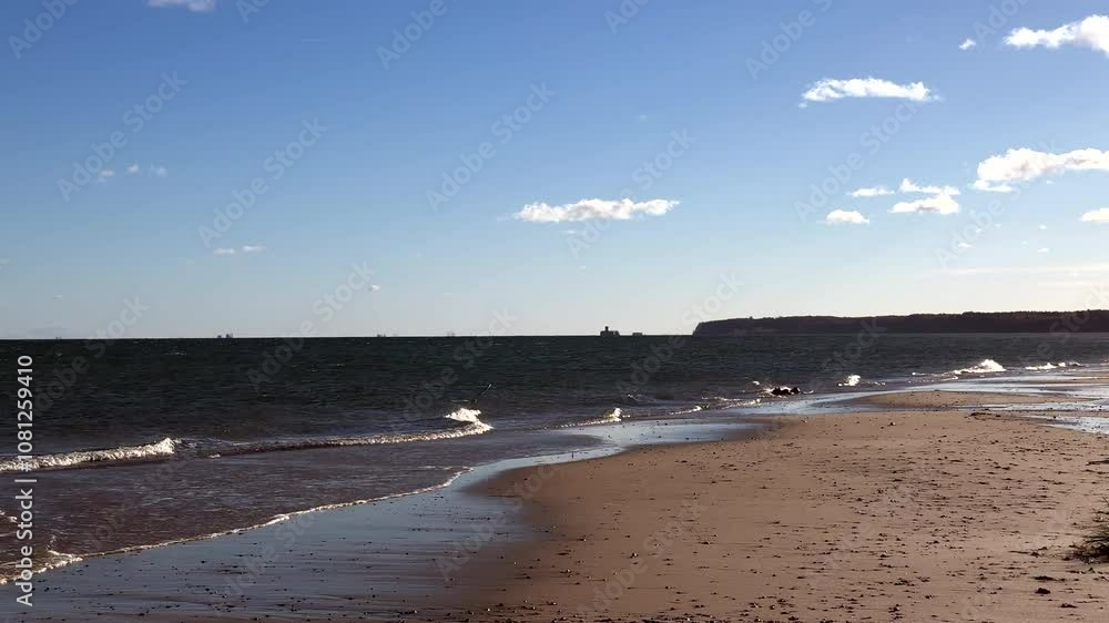 Sunny, windy weather by the sea. Sea beach in autumn. Sunny, windy weather by the sea. Sea beach in autumn.