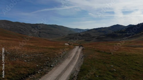 Drone flight over Mountainbiker in the mountains