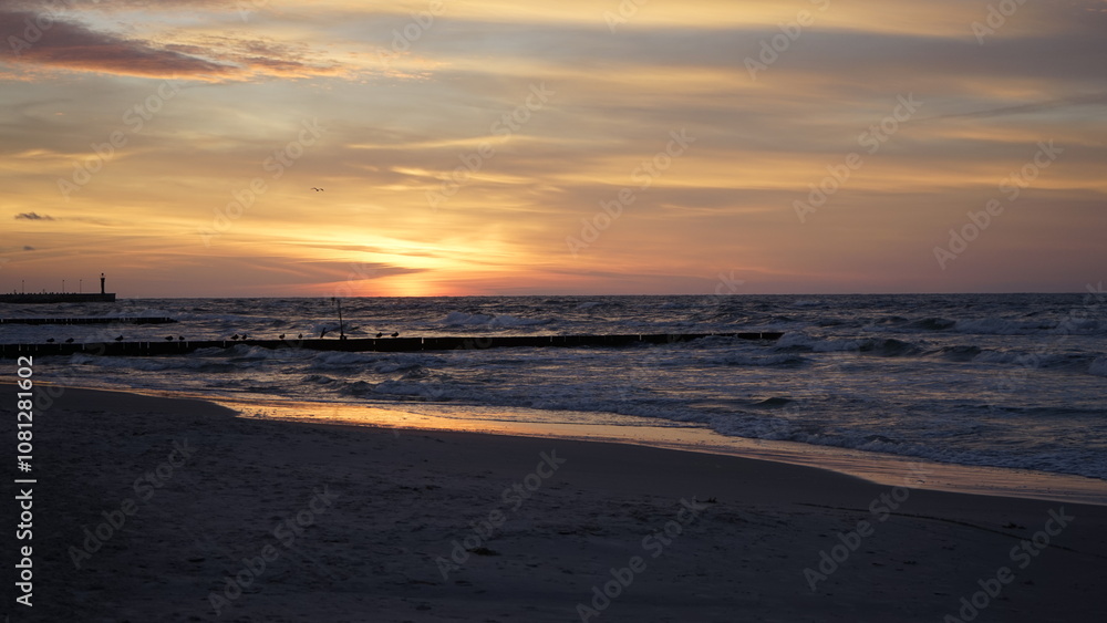 Sunset on the beach by the sea Sunset on the beach by the sea