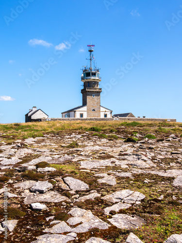 Lighthouse on Rocky Landscape of Pointe du Raz, Brittany photo