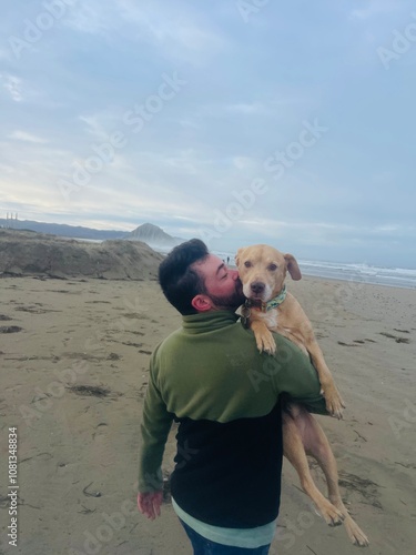 Man Carrying Dog on Shoulder