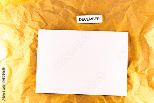 empty paper with blank christmas calendar on yellow background blank sheet of plans for meetings and events for the month december