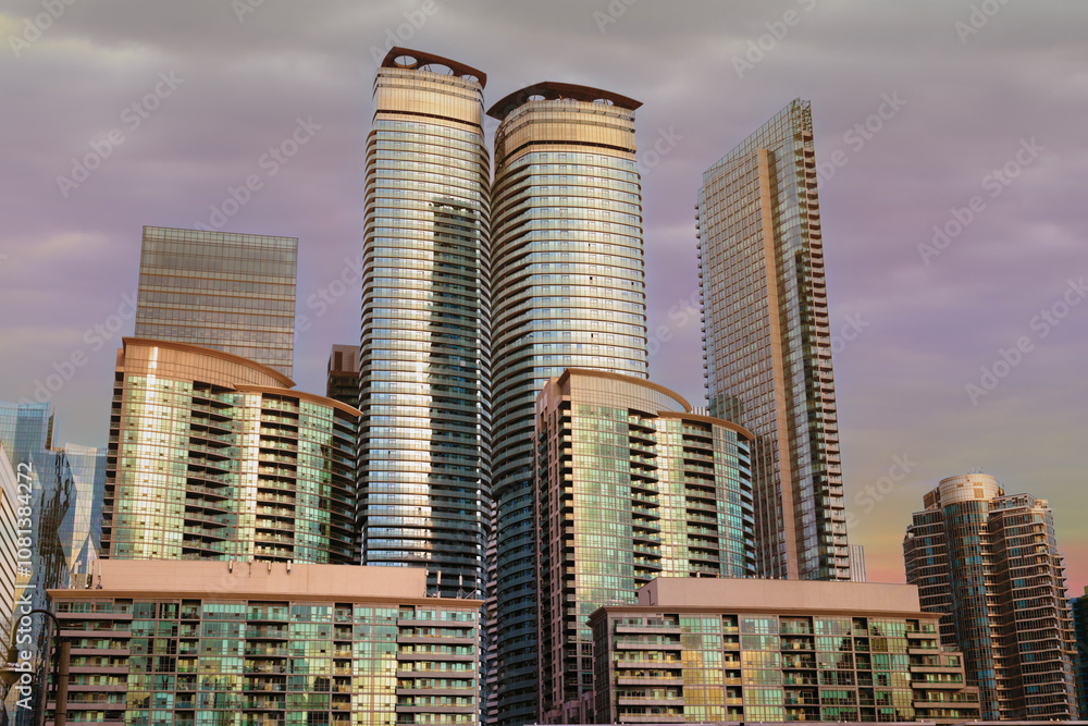 Naklejka premium Toronto buildings exterior and sky view in Toronto, Ontario, Canada. Sunset in background.