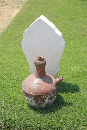 Kembang Setaman during Nyekar or pilgrimage to the grave. The shape of the grave in Indonesia