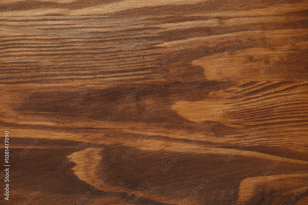 Applying walnut wood stain. Texture of wooden surface as background, top view Applying walnut wood stain. Texture of wooden surface as background, top view