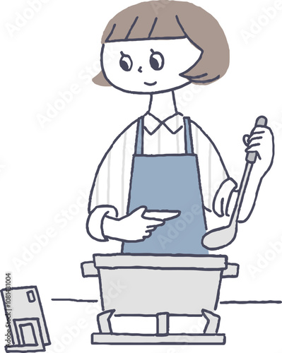 動画を見ながら料理をする女性