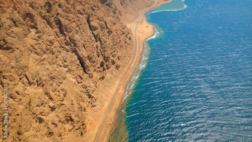 Beautiful ocean meeting Saudi Arabia shore near rocky mountains - high shot
