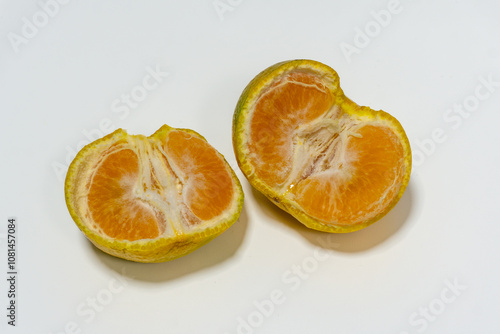 Medan tangerine (Citrus reticulata) is a popular Indonesian citrus known for its sweet, juicy, and fragrant flesh. It has a bright orange color, easy-to-peel skin, rich in vitamin C and antioxidants. photo