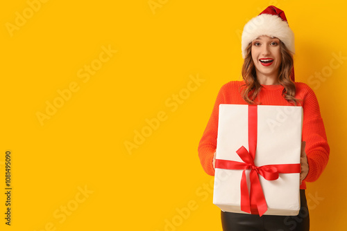 Happy young woman in Santa ...