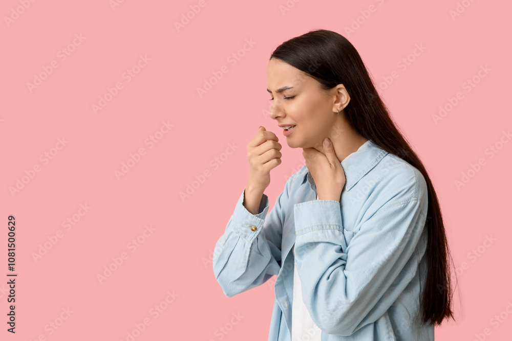 Beautiful young woman suffering from sore throat on pink background Beautiful young woman suffering from sore throat on pink background