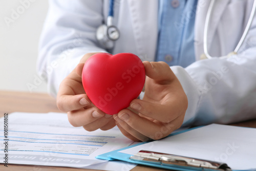 Female doctor holding red h...