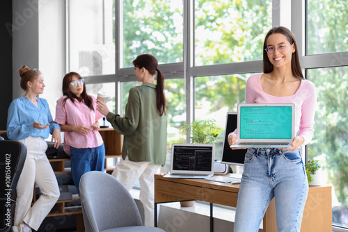 Female programmer with lapt...