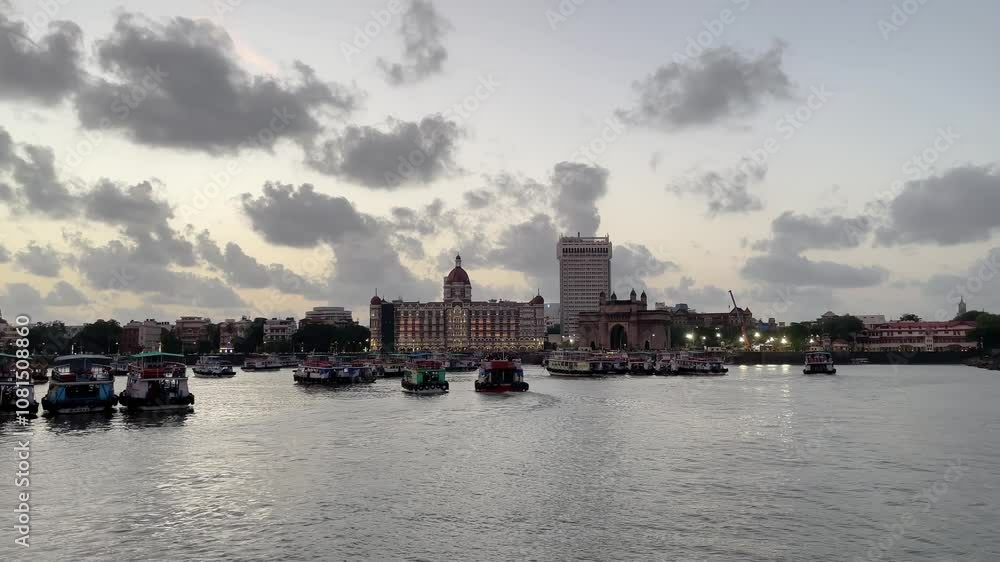Boats docked near the iconic Gateway of India, with clouds overhead. Boats docked near the iconic Gateway of India, with clouds overhead.