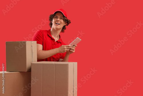 Male courier with cardboard...