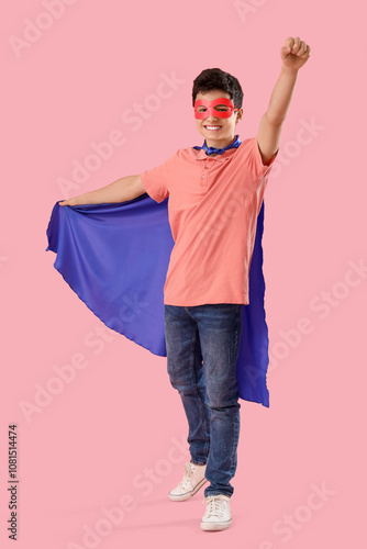Teenage boy dressed as supe...