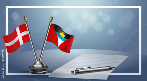 Denmark and Antigua and Barbuda Small national flag on bokeh background, cooperative relationship