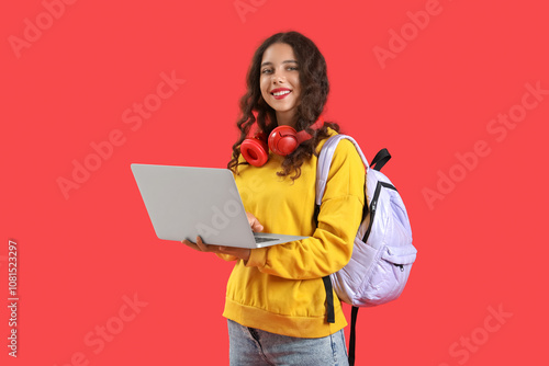 Female student with laptop ...
