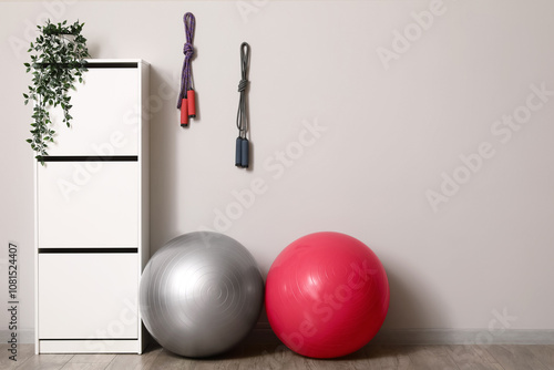 Fitballs and chest of drawe...
