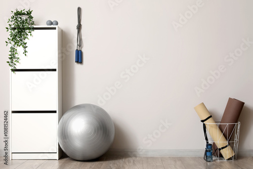 Fitball with sports equipme...