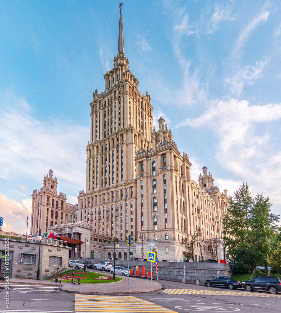 high-rise stalinist building near river at summer sunset in Moscow, Russia. Historic name is Hotel Ukraine. high-rise stalinist building near river at summer sunset in Moscow, Russia. Historic name is Hotel Ukraine.