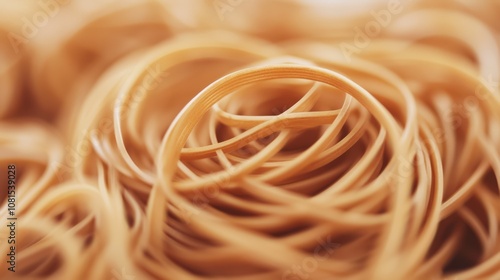 A close-up of a pile of brown rubber bands. photo