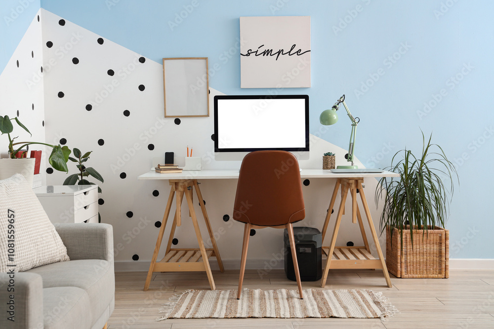 Interior of stylish living room with workplace and plants Interior of stylish living room with workplace and plants