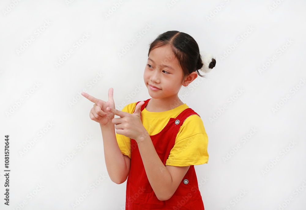 Portrait of Asian young girl child look and pointing beside on white background. Portrait of Asian young girl child look and pointing beside on white background.