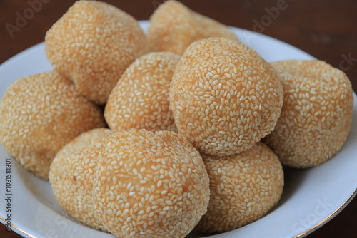 Onde-onde or sesame seed ball on a plate, popular traditional food in Indonesia photo