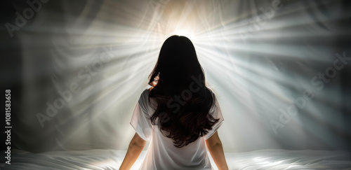 A chilling scene unfolds as a possessed woman contorts in bed, while a brave priest performs an intense exorcism.
