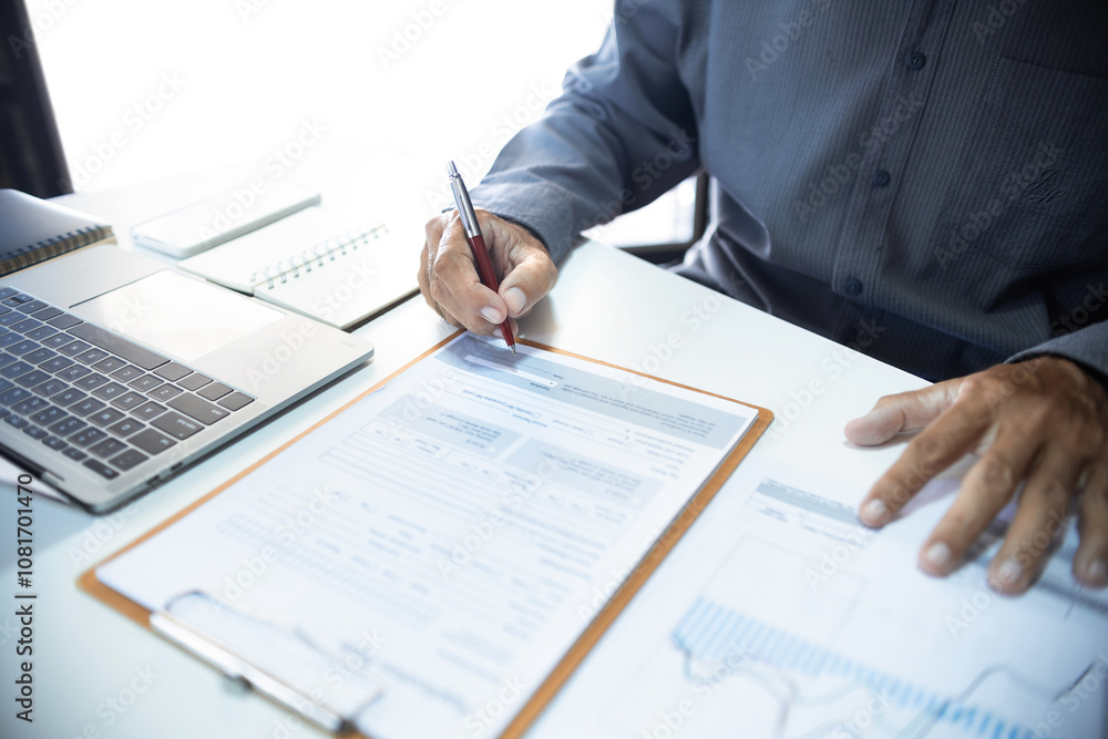 Asian businessman review business documents and contract before sign after analyzing investment chart, investment planning and business analysis concept Asian businessman review business documents and contract before sign after analyzing investment chart, investment planning and business analysis concept