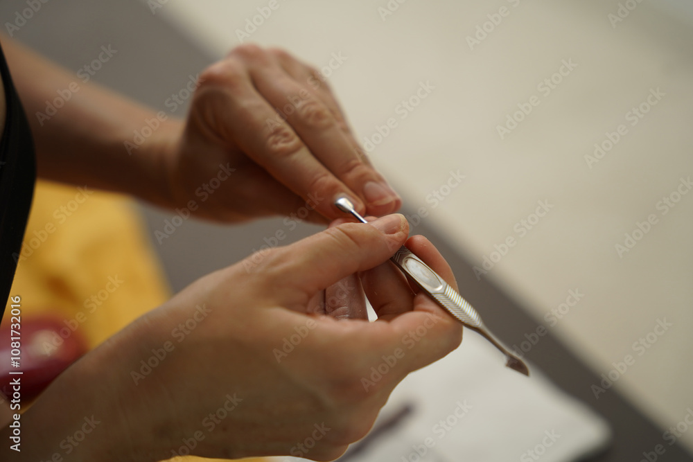 A woman doing a manicure and pedicure A woman doing a manicure and pedicure